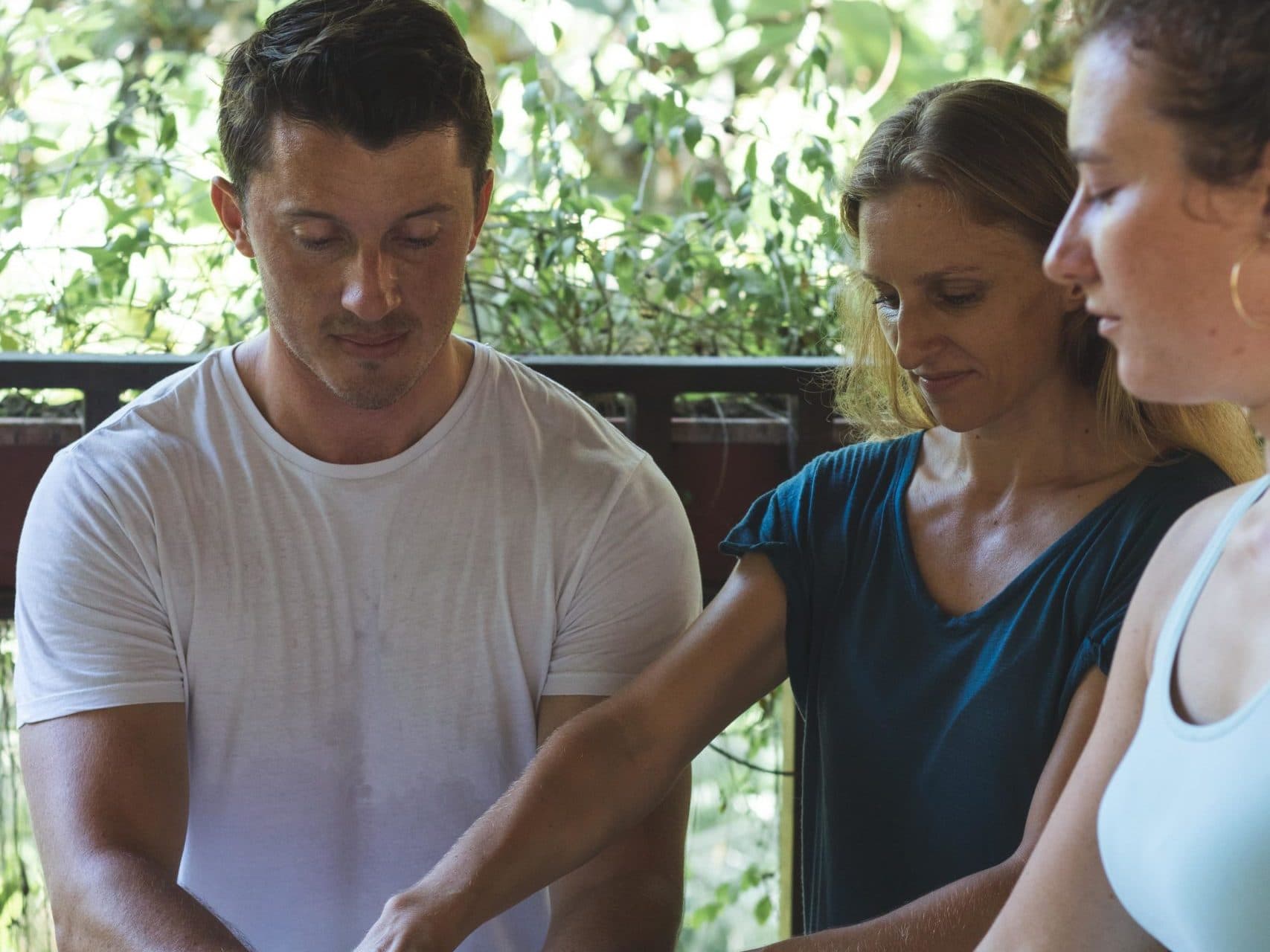 Vanessa guiding two students through a Reiki attunement